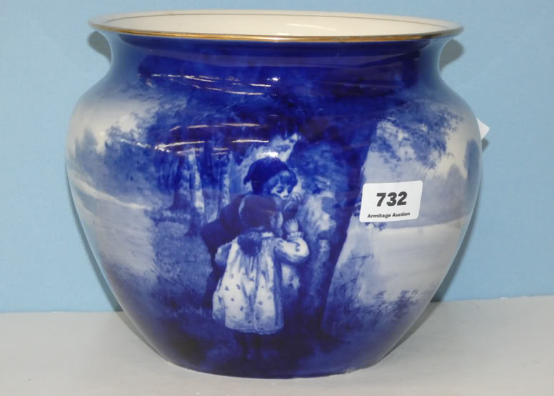 A blue ceramic pot with a painted scene of a person in a dress standing by a tree, with a sticker labeled "732" on the side.